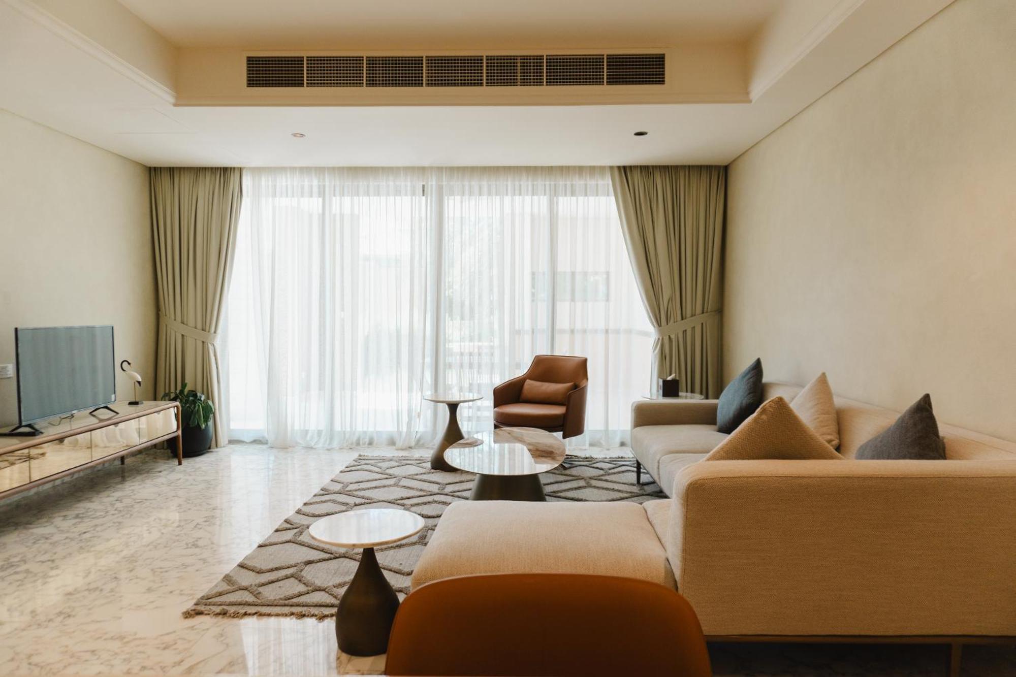 Palavra Resort Manama Ngoại thất bức ảnh A living room in a condominium