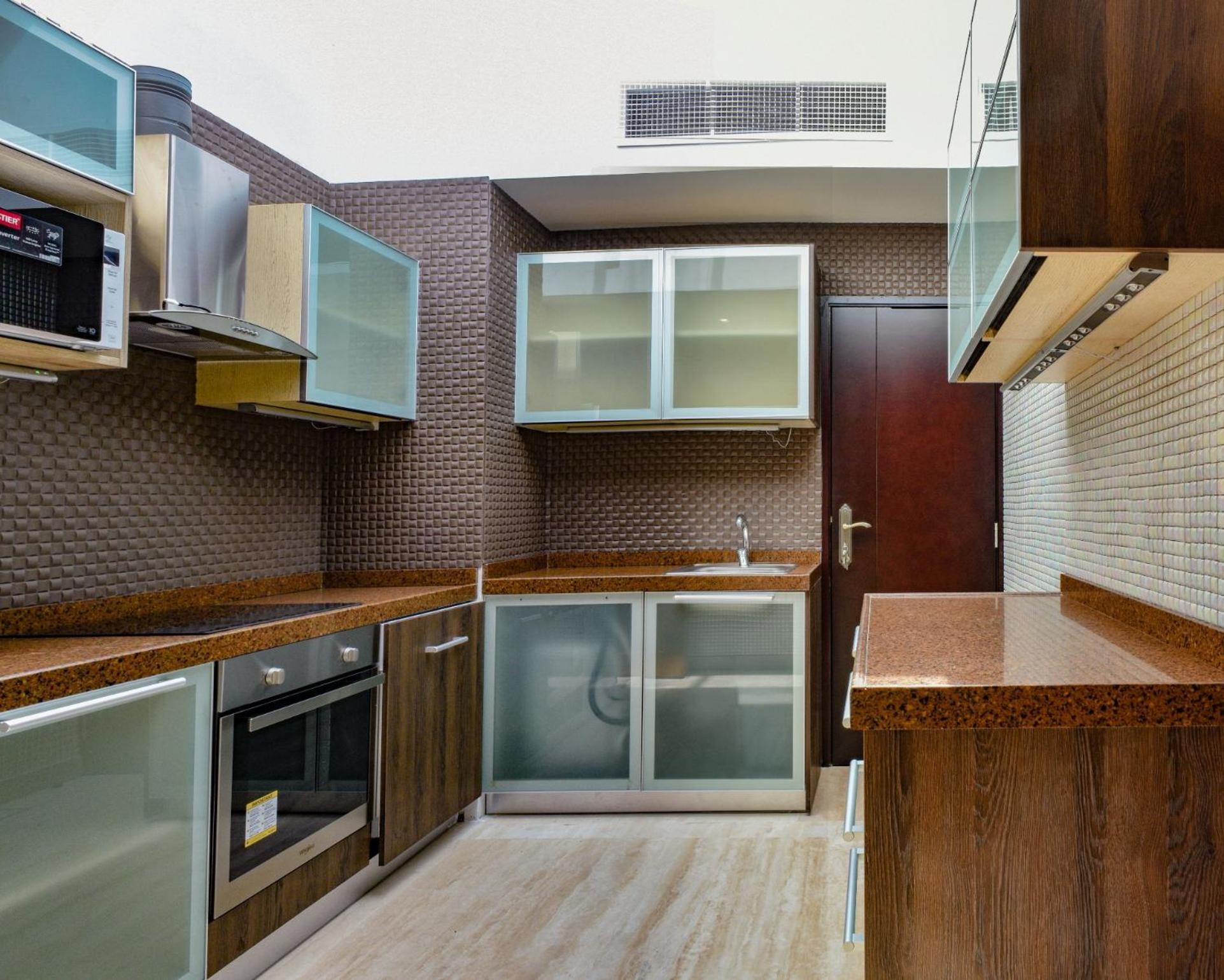 Palavra Resort Manama Ngoại thất bức ảnh A modern kitchen